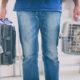 little dog in the airline cargo pet carrier at the airport after a long journey